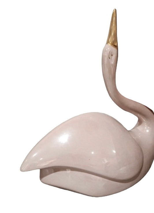 Antique pink swan with golden beak